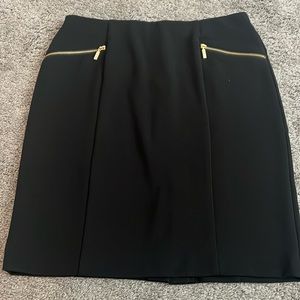 Black pencil skirt with gold zipper detail